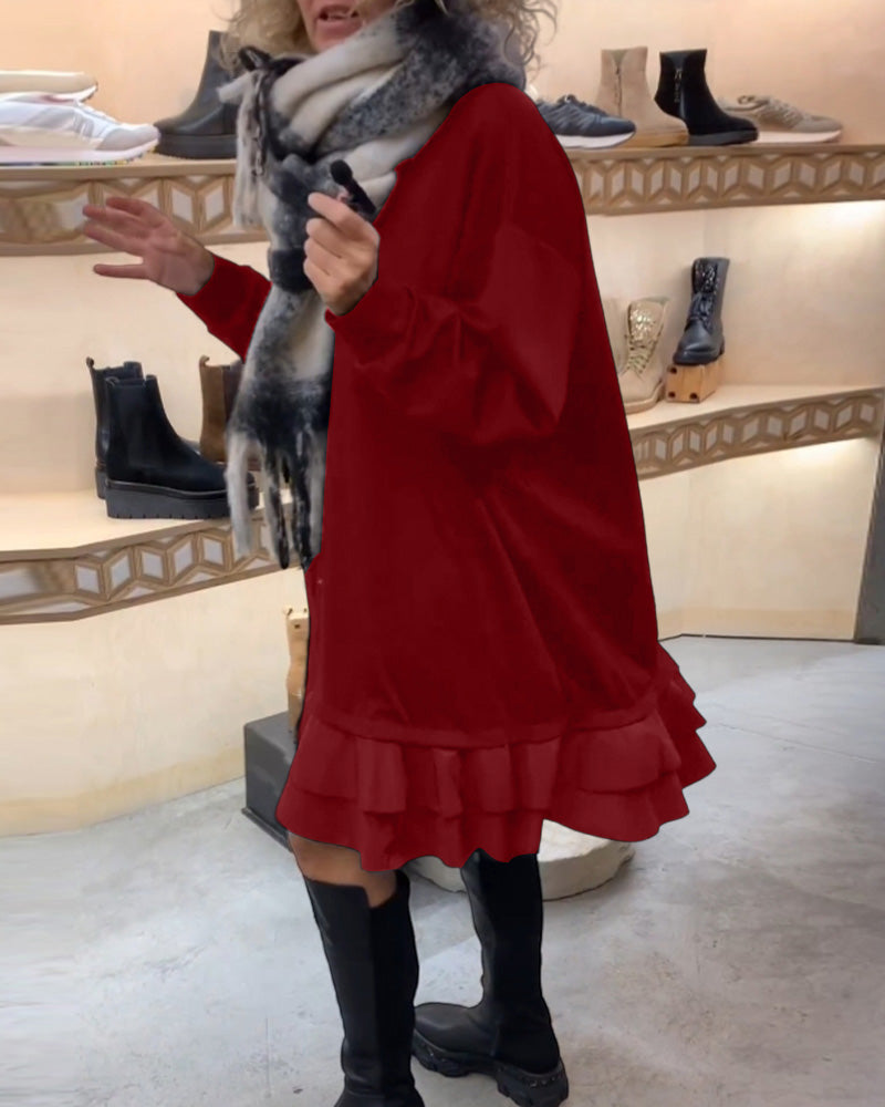 Klänning med elegant siluett och långa ärmar