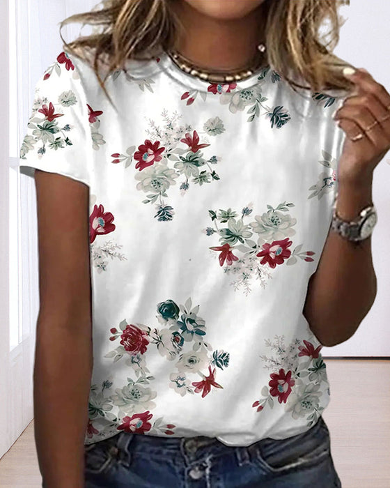 T-shirt i blommönster med rund hals och kort ärm
