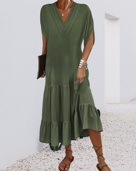 Enfärgad klänning med slitsärm och patchwork