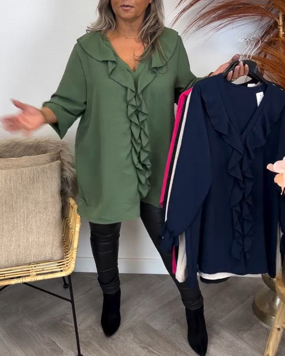 Ensfarget elegant topp med volang