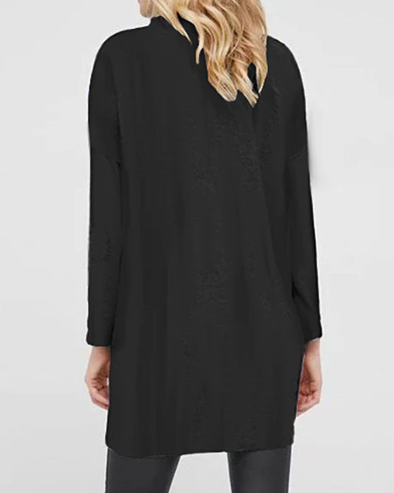 Enfärgad topp med korsdesign