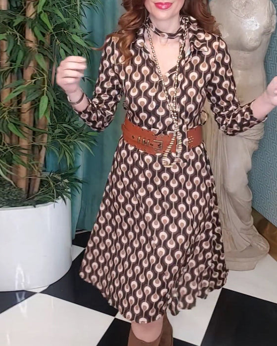 Elegant 3/4-ärmad klänning med tryck