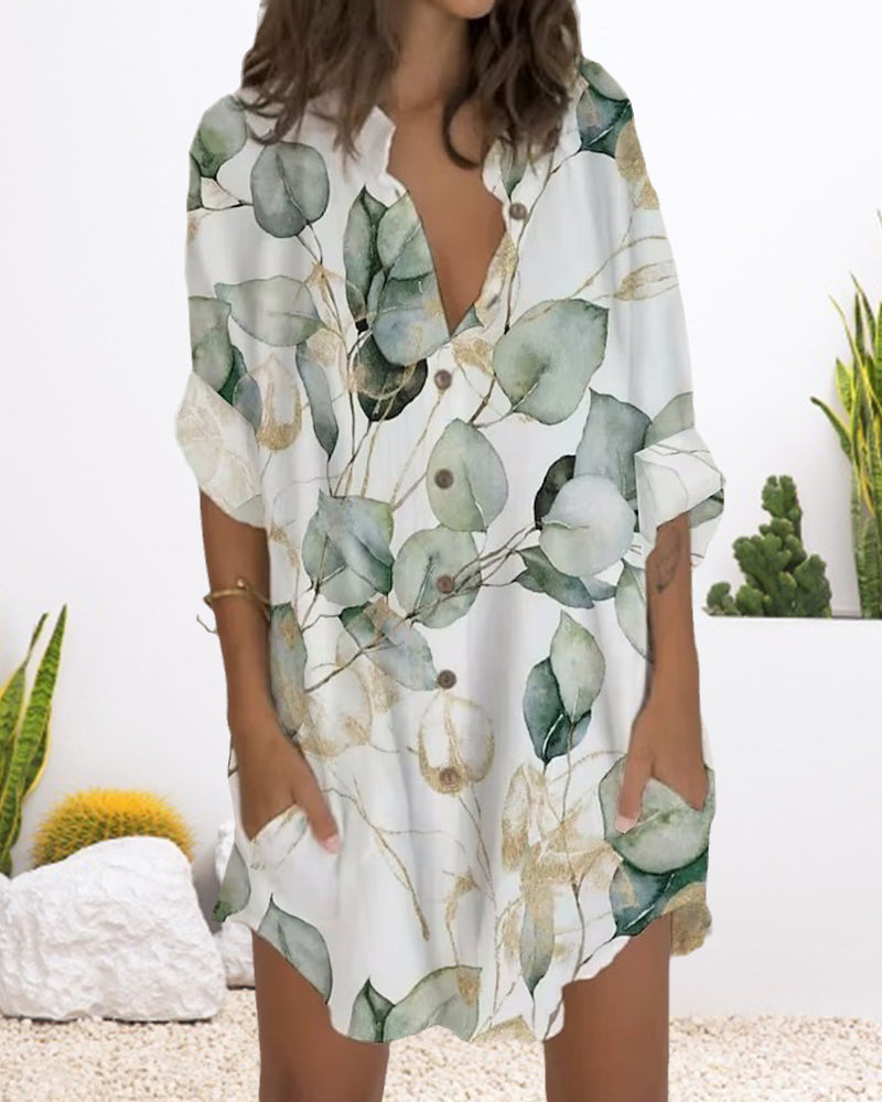 Klänning med knapptryck med lång ärm och ficka