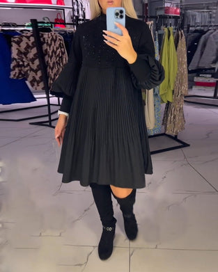 Klänning med ballongärmar och stativkrage