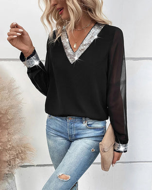 Blus med paljetter och V-ringning