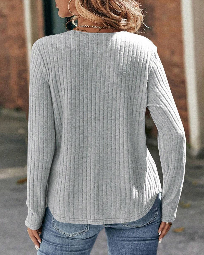 Långärmad spets i panel med rund hals