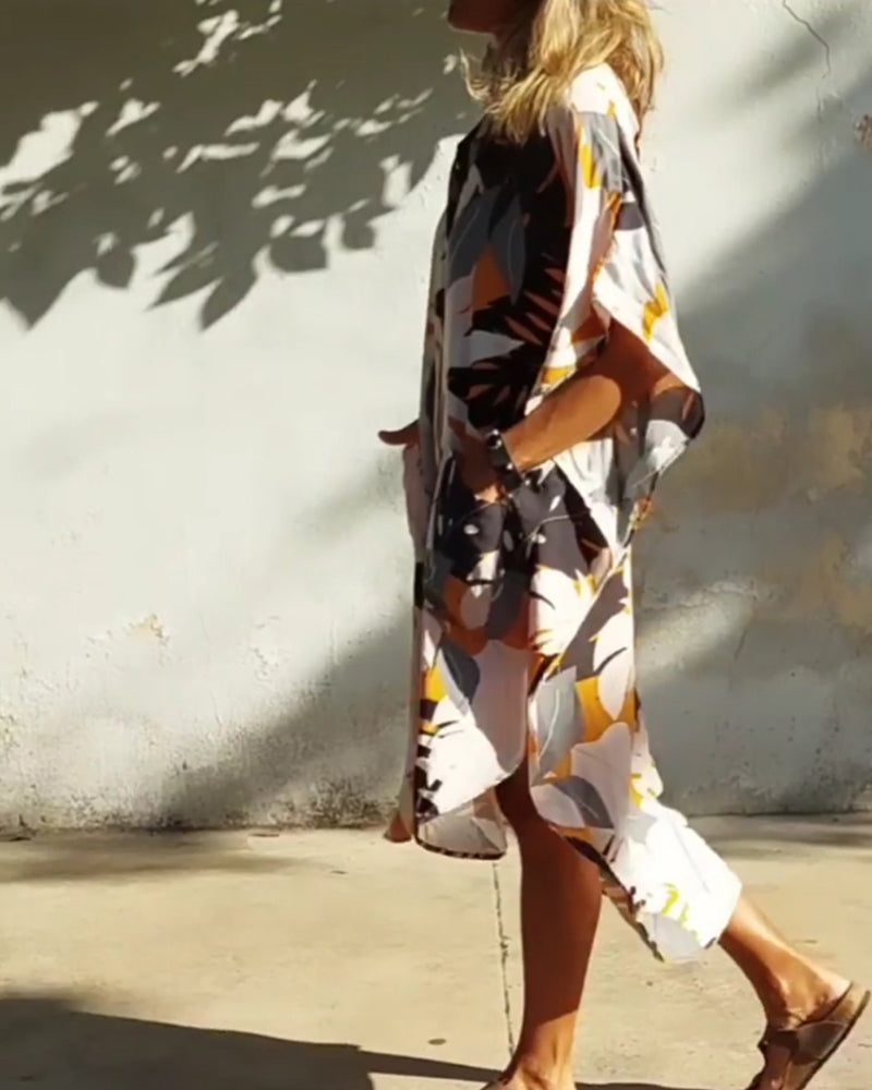 Klänning med fickor och lönnlövstryck