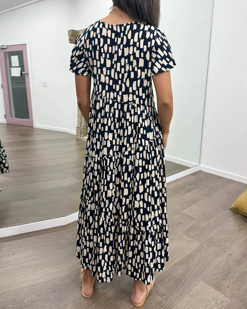 Klänning med geometriskt tryck och korta ärmar