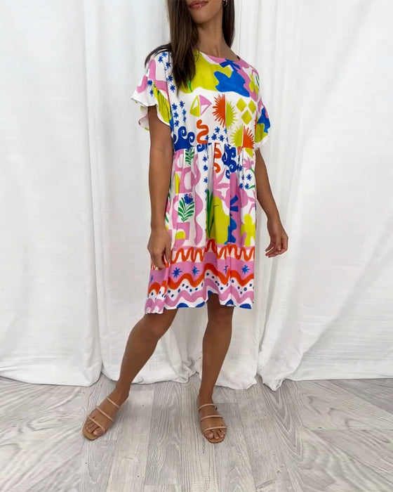 Kortärmad klänning med tryck och rund hals