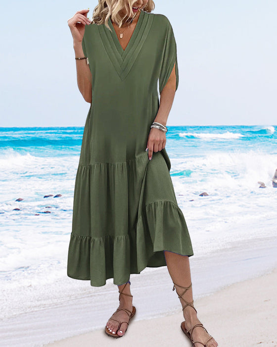 Enfärgad klänning med slitsärm och patchwork