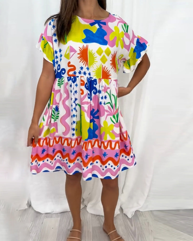 Kortärmad klänning med tryck och rund hals