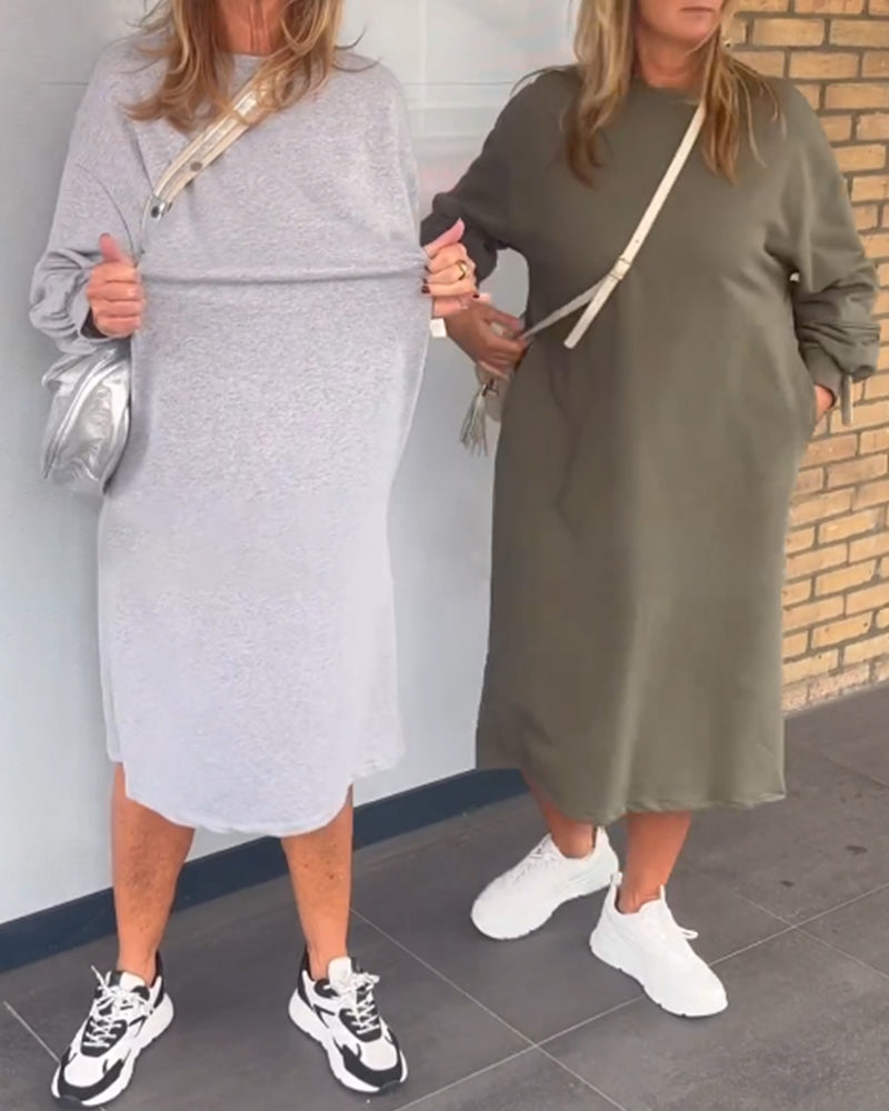 Enfärgad fickklänning med rund hals