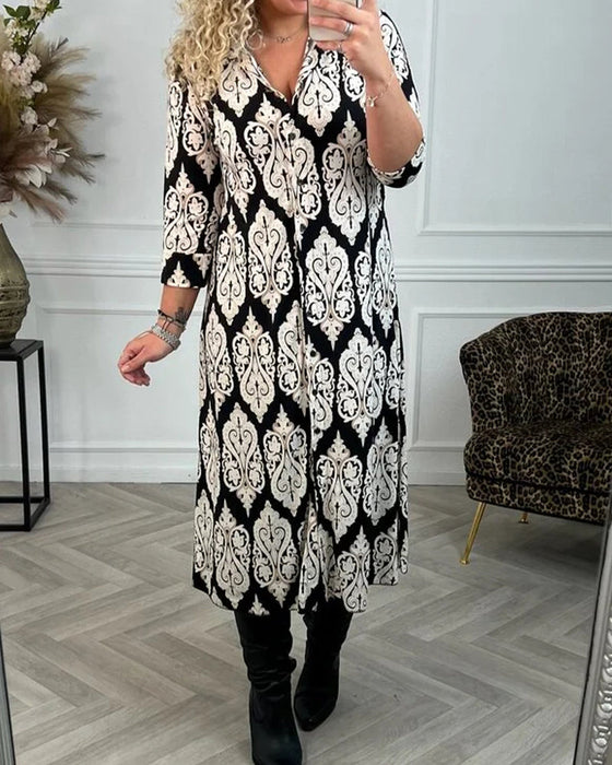 Lapelklänning med tryck i sidled