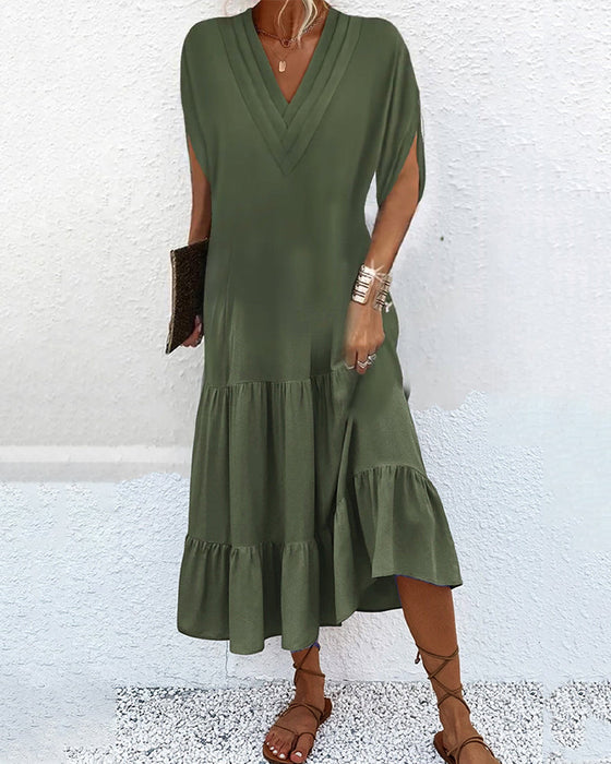 Enfärgad klänning med slitsärm och patchwork