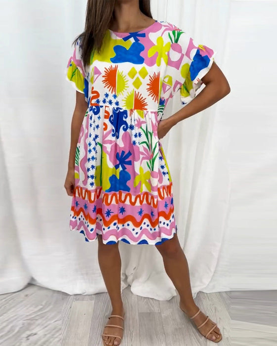 Kortärmad klänning med tryck och rund hals