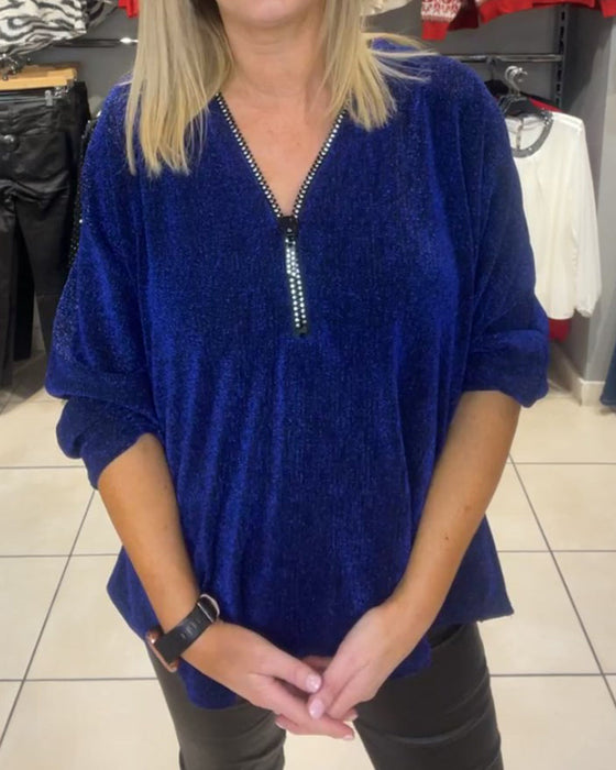 Löst topp med långa ärmar och dragkedja