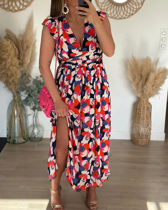 Klänning med V-ringning och ärmlös och tryckt