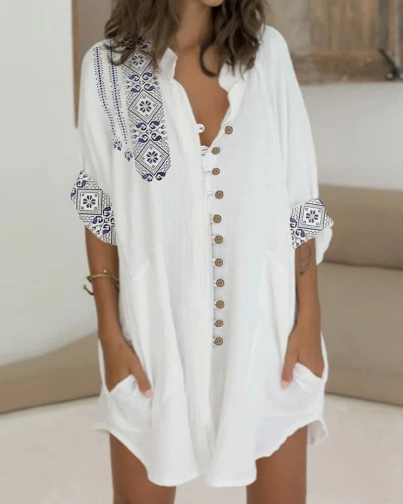 Klänning med 3/4-ärmar och knappar