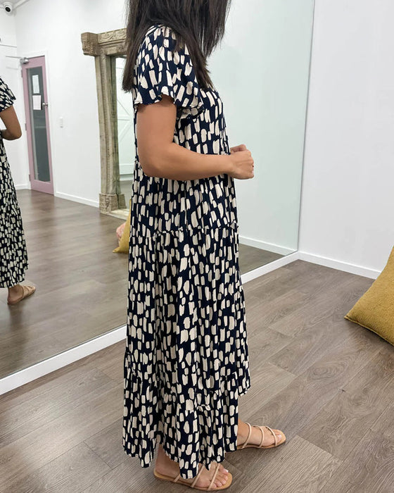 Klänning med geometriskt tryck och korta ärmar