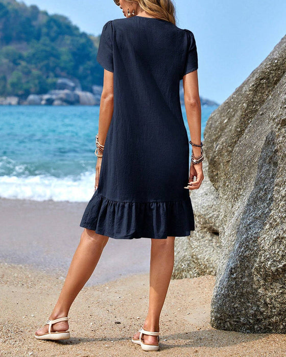 Kortärmad patchworkklänning med rund hals