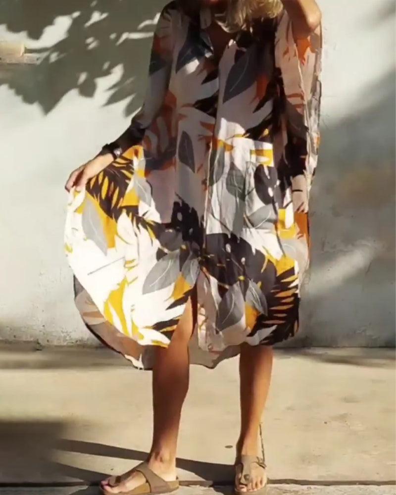 Klänning med fickor och lönnlövstryck