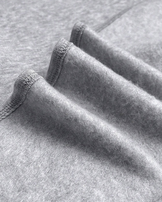 Lös klänning med långa ärmar och fickor