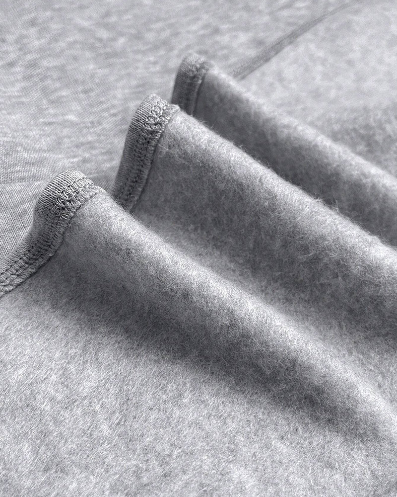 Lös klänning med långa ärmar och fickor