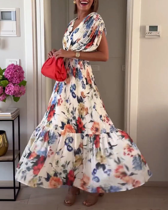 Färgglad blommig plisserad elegant klänning