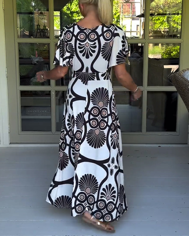 Kortärmad klänning med vintagetryck