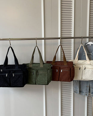 Enfärgad manchesterväska