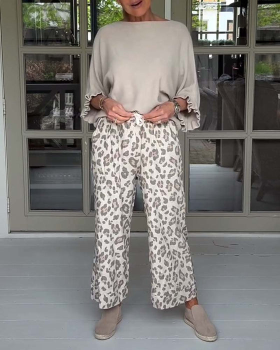 Lediga byxor med leopardmönstrad ficka