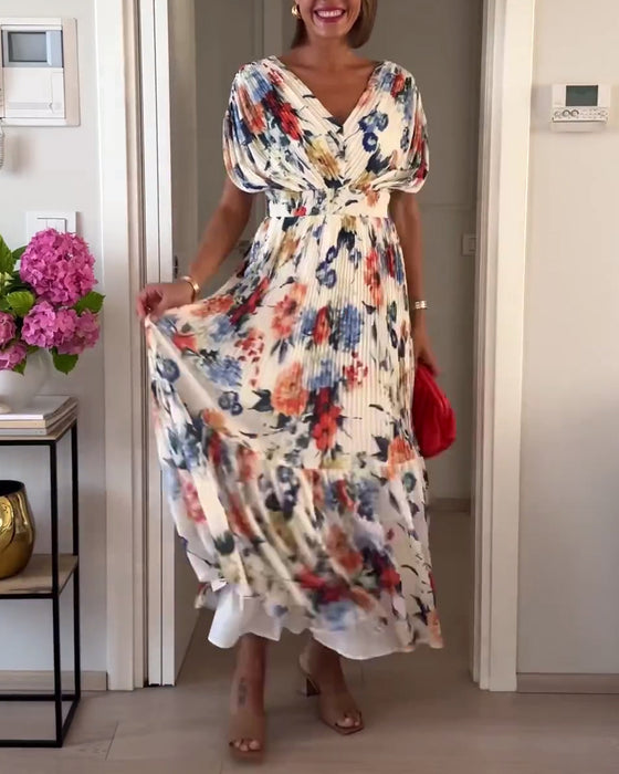 Färgglad blommig plisserad elegant klänning