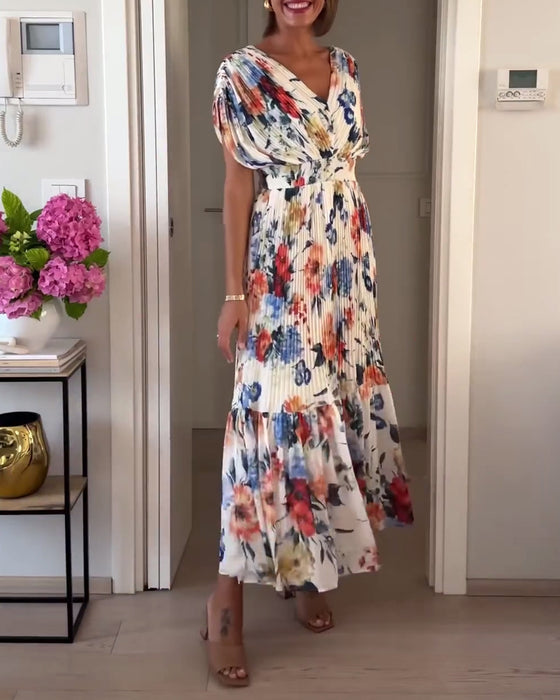 Färgglad blommig plisserad elegant klänning
