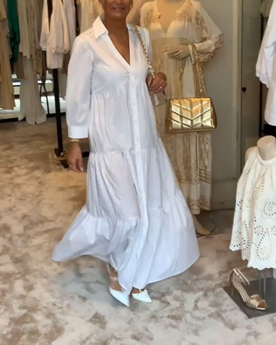 Klänning med knappar och slag