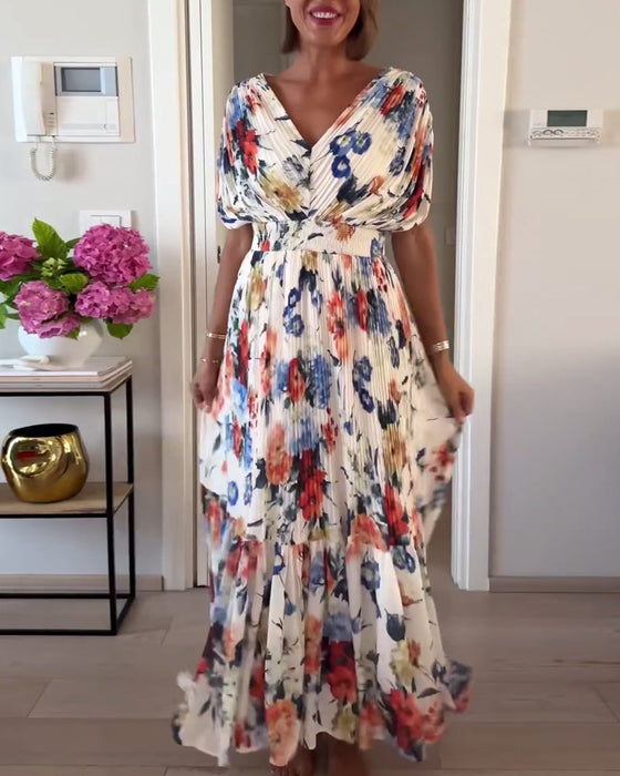 Färgglad blommig plisserad elegant klänning