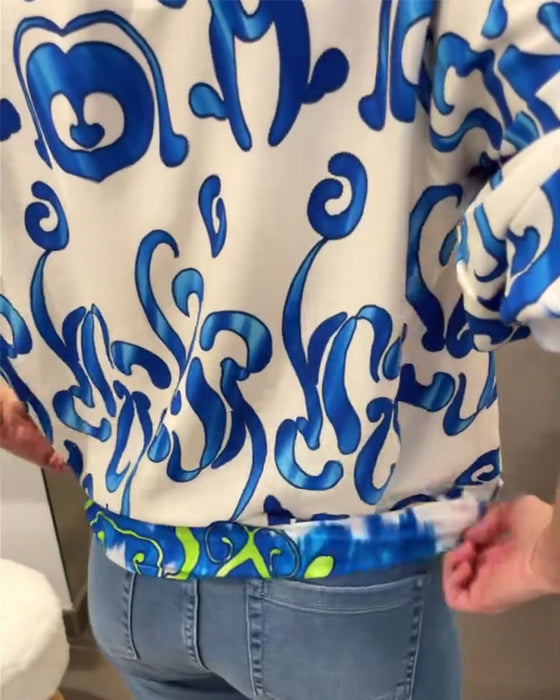 Elegant långärmad topp med tryckt V-ringning