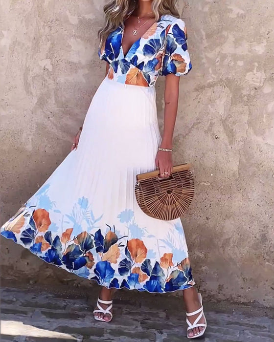 Klänning i djup V-modell med bubbliga ärmar