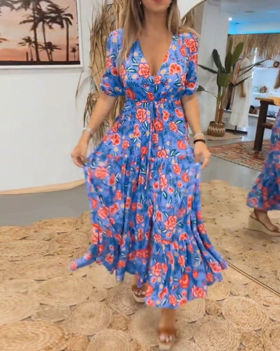 Klänning med rosentryck och slitsar