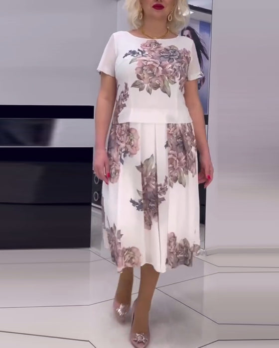 Blommig elegant klänning med rund hals