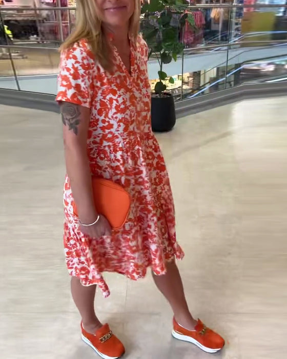 Kortärmad blommig midiklänning