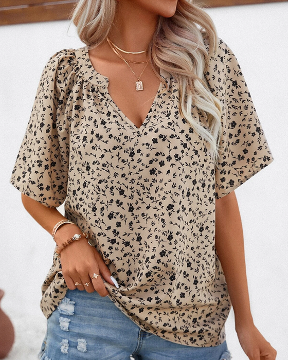 V-ringad blus med blommönster