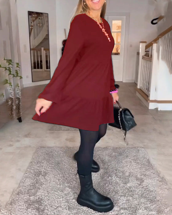 Enkel enfärgad långärmad klänning