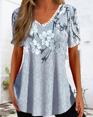 Elegant kort ärmad blus i blommigt tryck