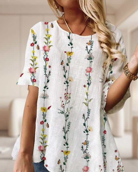 Topp med rund hals i blommönster