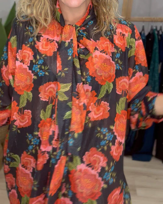 Blus med blommönster och lös passform