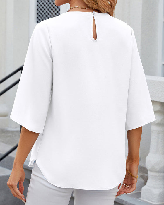 Elegant enfärgad blus med halv ärm