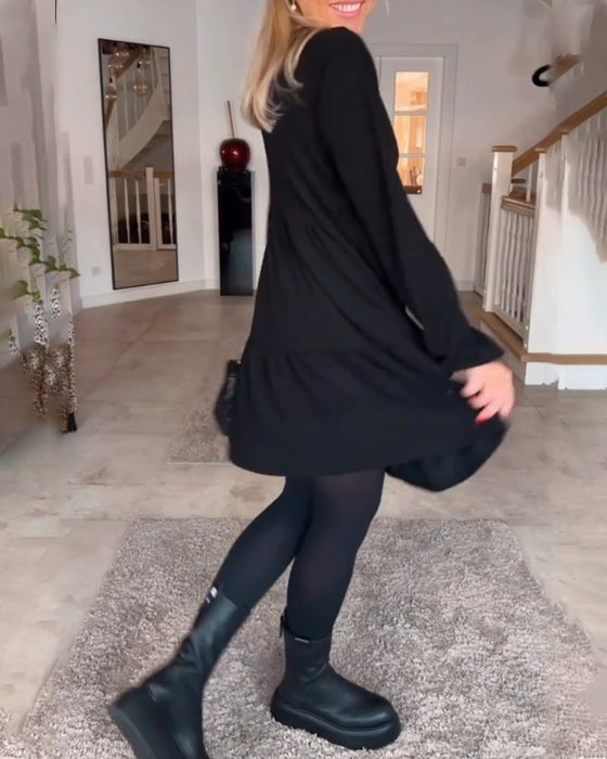 Enkel enfärgad långärmad klänning