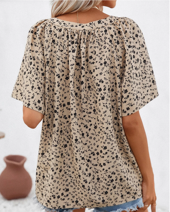 V-ringad blus med blommönster