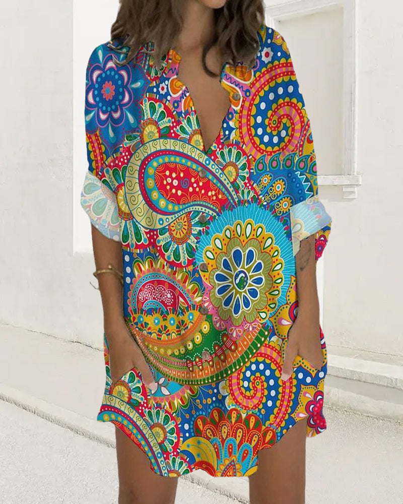 Klänning med knapptryck med lång ärm och ficka