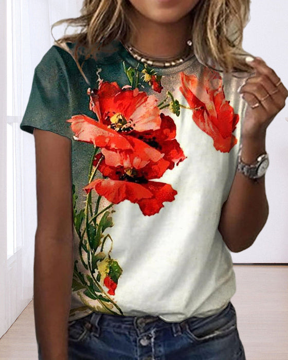 T-shirt i blommönster med rund hals och kort ärm